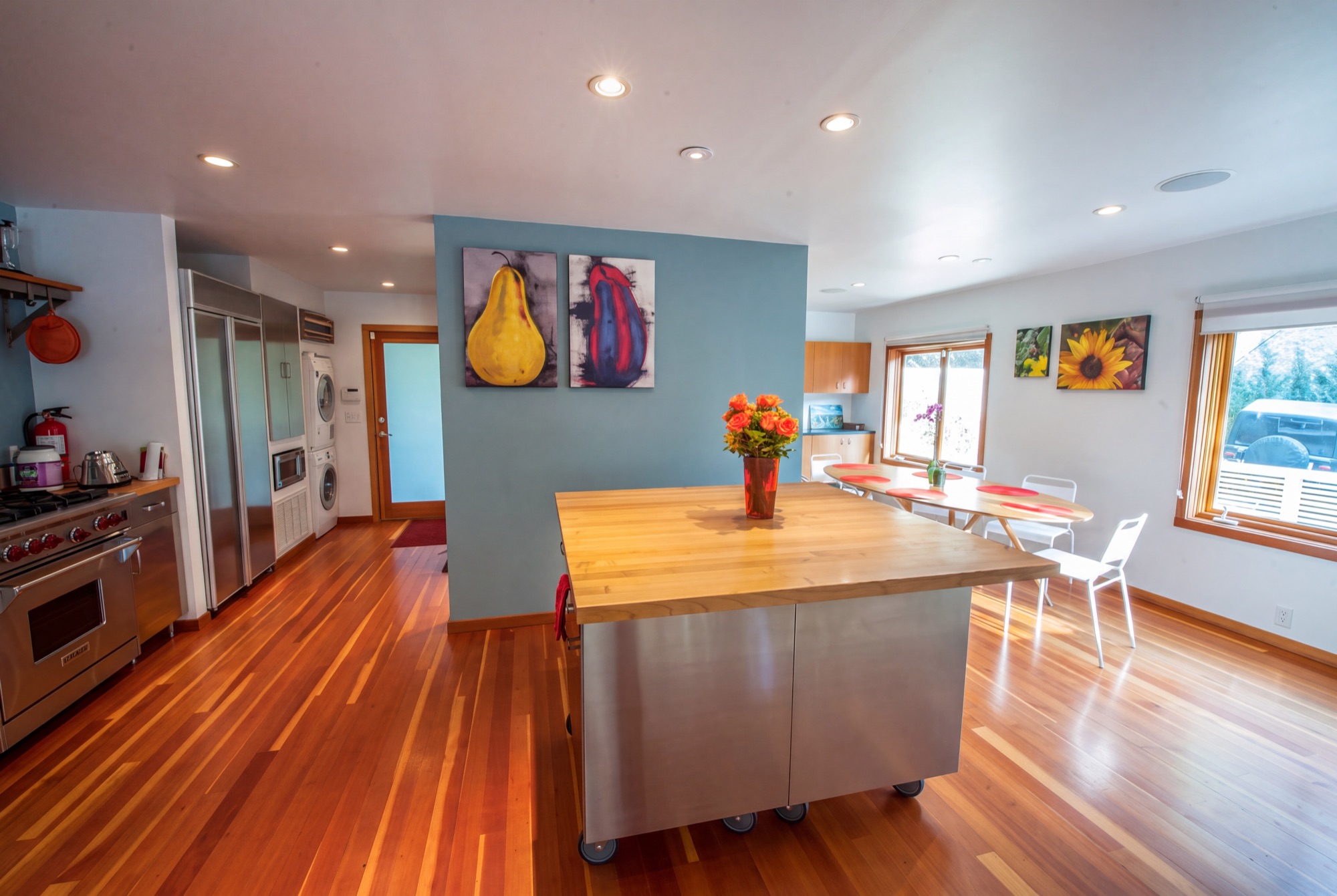 Bright chef's kitchen with communal dining